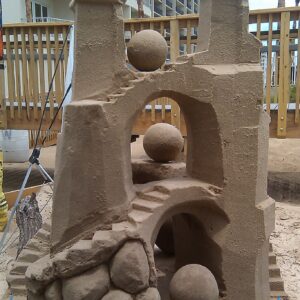 Picture shows a Twin Towered 4ft sandcastle with 2 bridges and many spheres all made using the science of sandcastles on south padre island by instructor andy hancock.